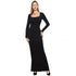 Woman wearing a fitted black long-sleeve maxi dress with square neckline.