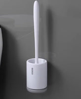 Minimalist white plastic toilet brush with holder, modern design, wall-mounted in bathroom