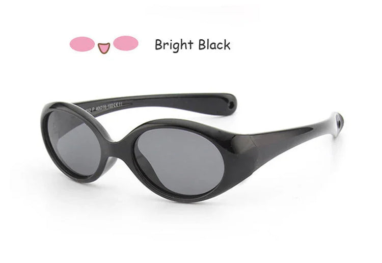 Bright black oval sunglasses with glossy plastic frame and dark tinted lenses