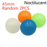 Set of four glossy rubber balls in white, blue, orange, and green, 45mm size.