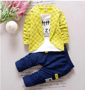 Yellow plaid jacket with white graphic tee and navy blue jogger pants, casual trendy outfit
