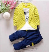 Yellow plaid jacket with white graphic tee and navy blue jogger pants, casual trendy outfit