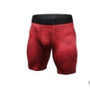 Red hexagonal-patterned compression shorts with black waistband, form-fitting athletic wear