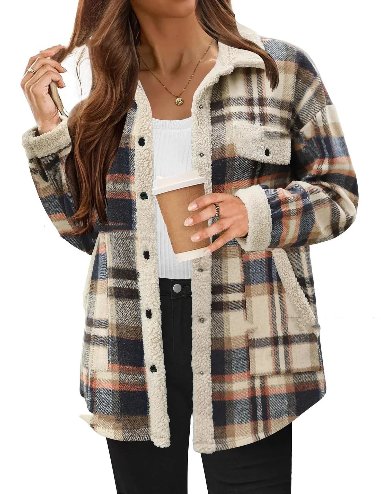 Woman wearing a beige and navy plaid sherpa-lined flannel jacket with relaxed fit