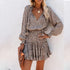 Woman wearing a leopard print long sleeve mini dress with a ruffled hem and relaxed fit