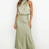 Sleeveless sage green satin halter maxi dress with draped neckline and relaxed fit