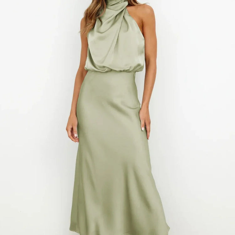 Sleeveless sage green satin halter maxi dress with draped neckline and relaxed fit