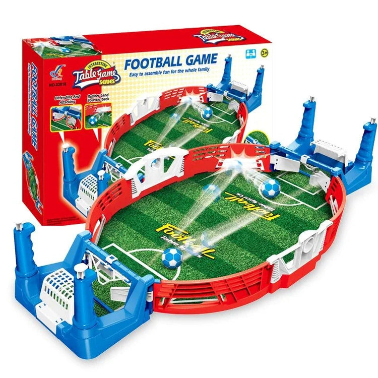 Mini tabletop soccer game with green field, red and blue plastic frame, and two goals
