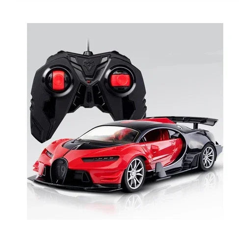 Red and black remote control sports car with matching black controller, sleek and glossy finish.