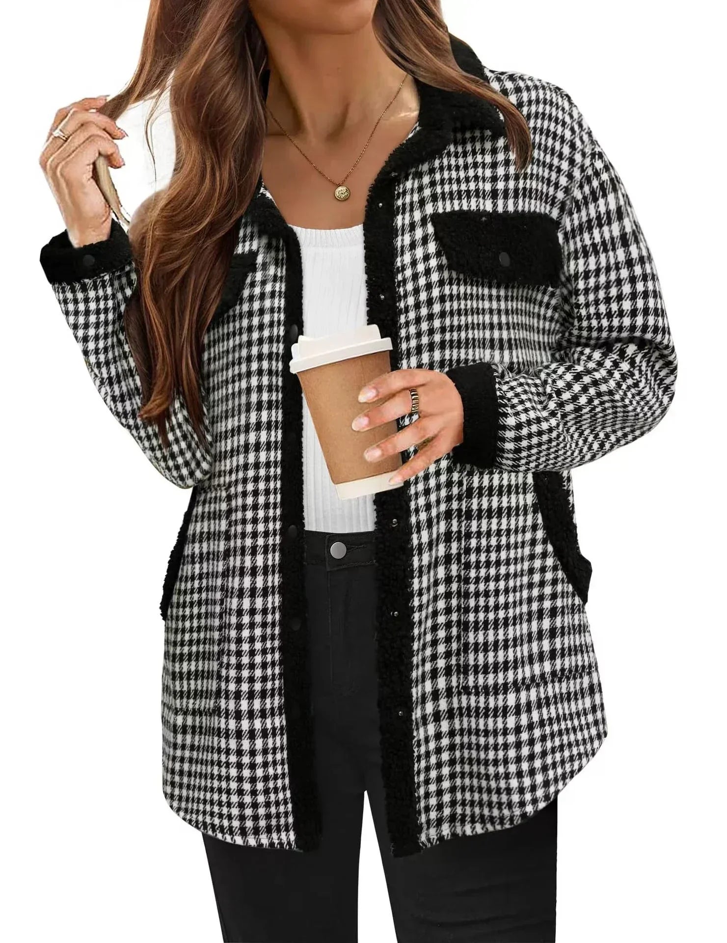 Woman wearing black and white houndstooth plaid fleece jacket with relaxed fit