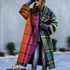 Woman wearing oversized plaid wool coat in bright rainbow colors with relaxed fit