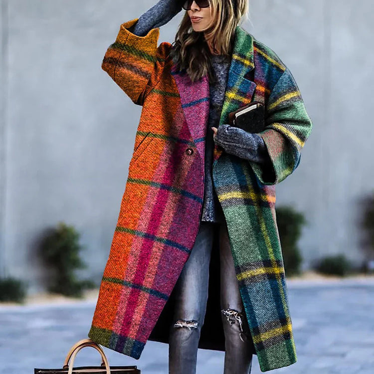 Woman wearing oversized plaid wool coat in bright rainbow colors with relaxed fit