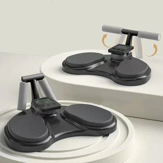 Black push-up board with foam handles, digital timer, and non-slip pads for home workouts