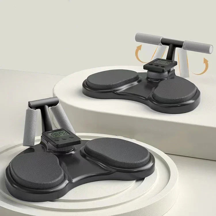 Black push-up board with padded handles, digital timer, and ergonomic design on display.