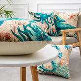Colorful ocean-themed throw pillows with teal sea creatures on linen fabric, modern home decor