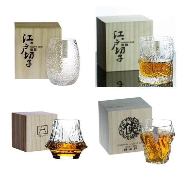 Set of four textured clear whiskey glasses with unique shapes, paired with wooden gift boxes.