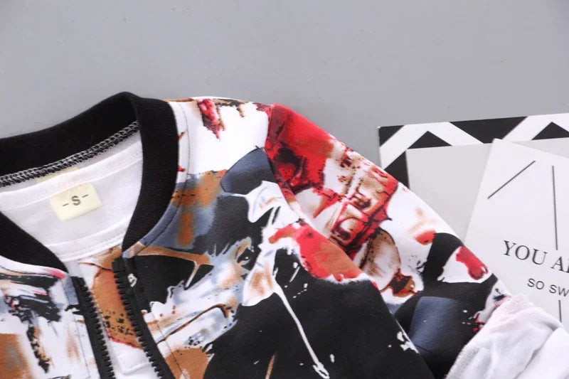 Close-up of unisex bomber jacket with abstract black, white, and red print, relaxed fit