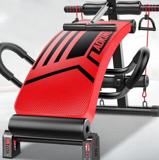 Adjustable red and black padded sit-up bench with resistance bands, sturdy steel frame