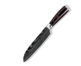 Black Damascus steel kitchen knife with wood handle and curved blade on white background