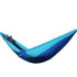 Light blue and navy nylon hammock with relaxed fit, featuring shoes visible at one end