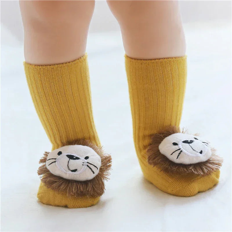 Yellow ribbed toddler socks with plush lion face design and soft texture