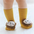 Yellow ribbed toddler socks with plush lion face design and soft texture