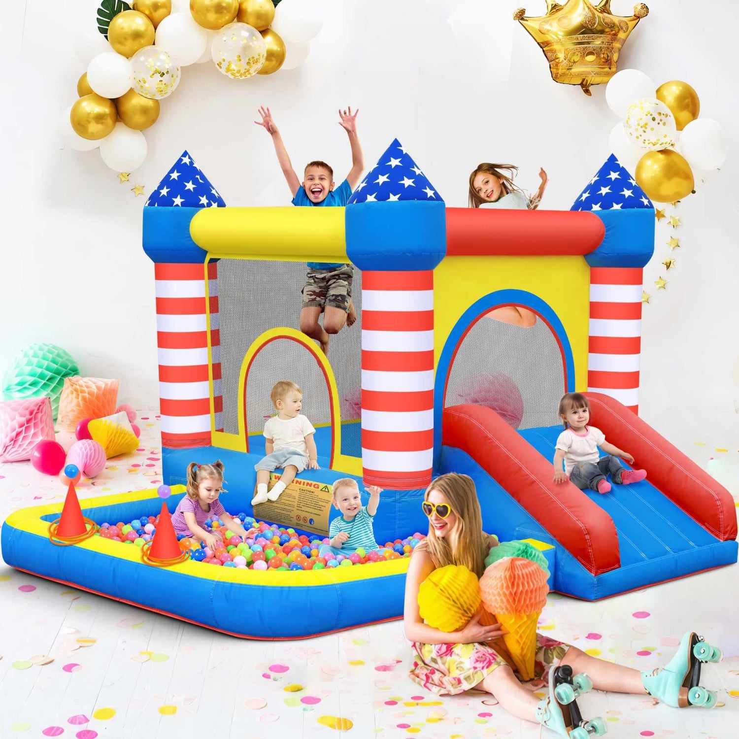 Children in casual summer outfits playing on a colorful inflatable bounce house and ball pit