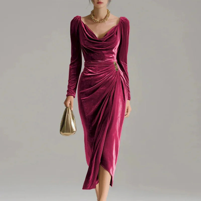 Woman wearing a long-sleeve velvet midi dress in deep pink with draped neckline and ruched waist