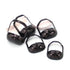 Set of black plastic handbag-shaped clips with glossy finish, displayed on white background