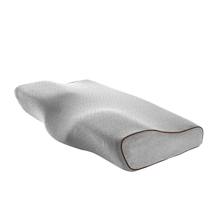 Contoured white memory foam pillow with ergonomic shape and breathable perforated cover