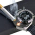 Black leather strap watch with built-in lighter, metallic bezel, and analog display.
