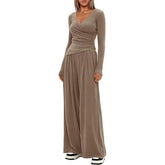 Taupe long sleeve wide leg jumpsuit with V-neck and relaxed fit, soft draped fabric
