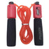 Red jump rope with foam grips and built-in counter, fitness accessory, durable plastic.