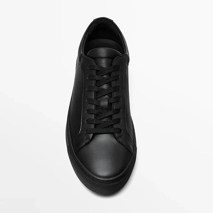 Minimalist black leather sneaker with lace-up design and low-top fit on white background