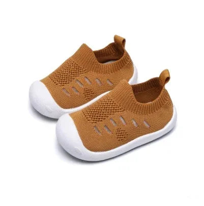 Brown knit slip-on kids shoes with white rubber soles and breathable mesh design.