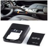 Anti-theft car steering wheel lock with black fabric cover and portable GPS tracker device.