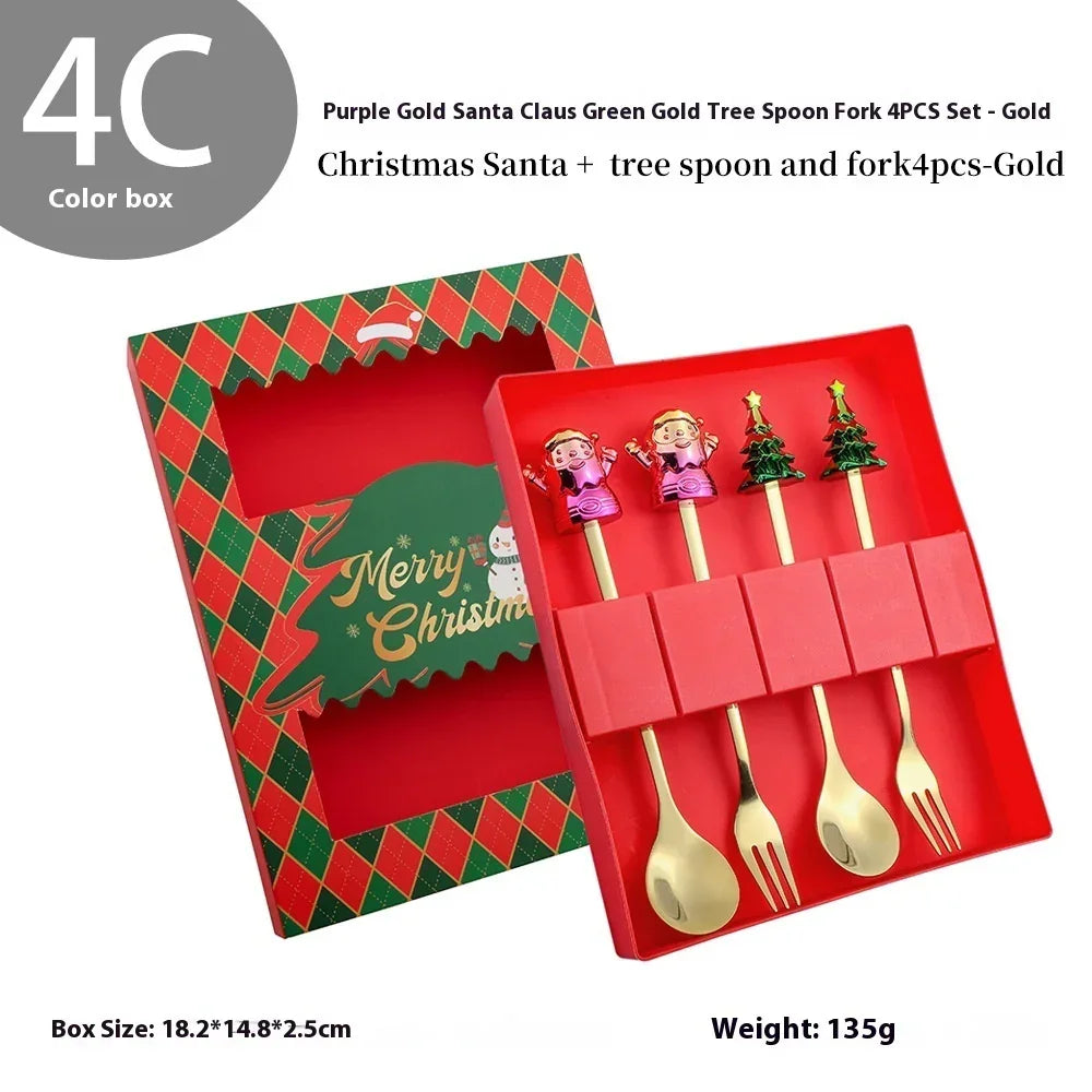 Gold stainless steel spoon and fork set with festive Christmas Santa and tree handles in red gift box.