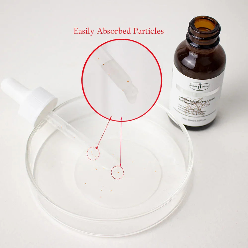 Clear dropper with small particles, brown glass serum bottle, and petri dish on white background