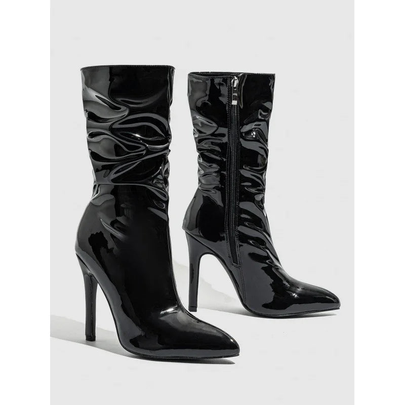 Shiny black patent leather ankle boots with pointed toe and high stiletto heel
