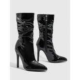 Shiny black patent leather ankle boots with pointed toe and high stiletto heel