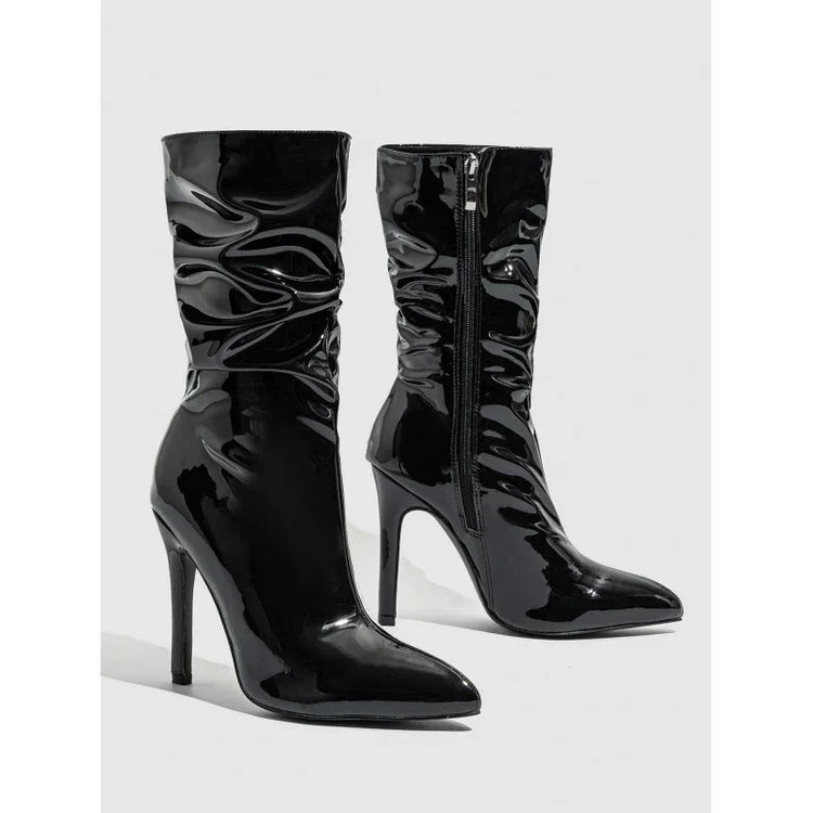 Shiny black patent leather ankle boots with pointed toe and high stiletto heel