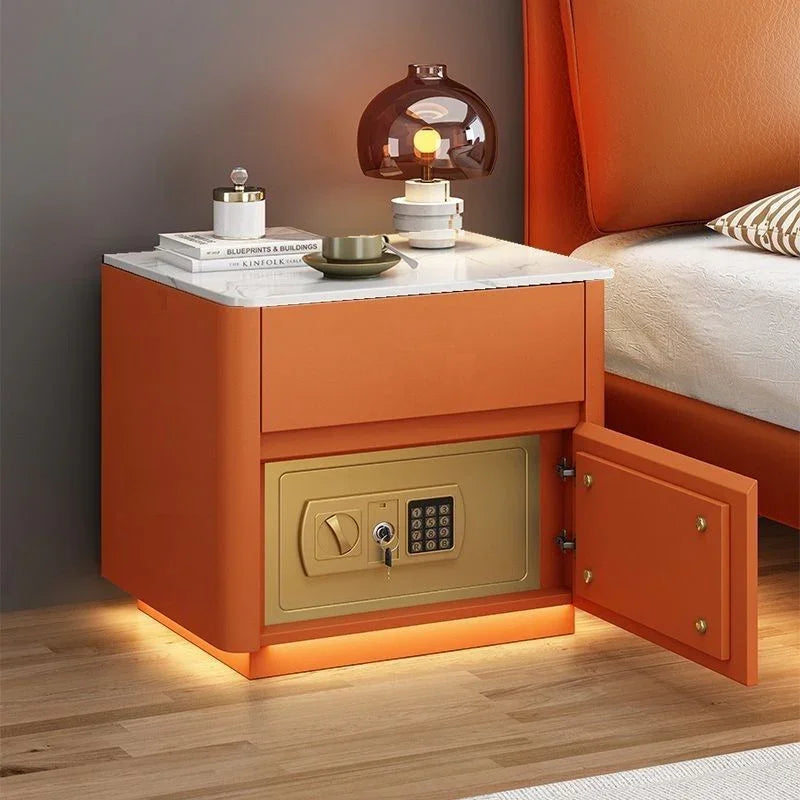 Modern orange bedside table with marble top and built-in electronic safe, soft lighting, minimalist decor