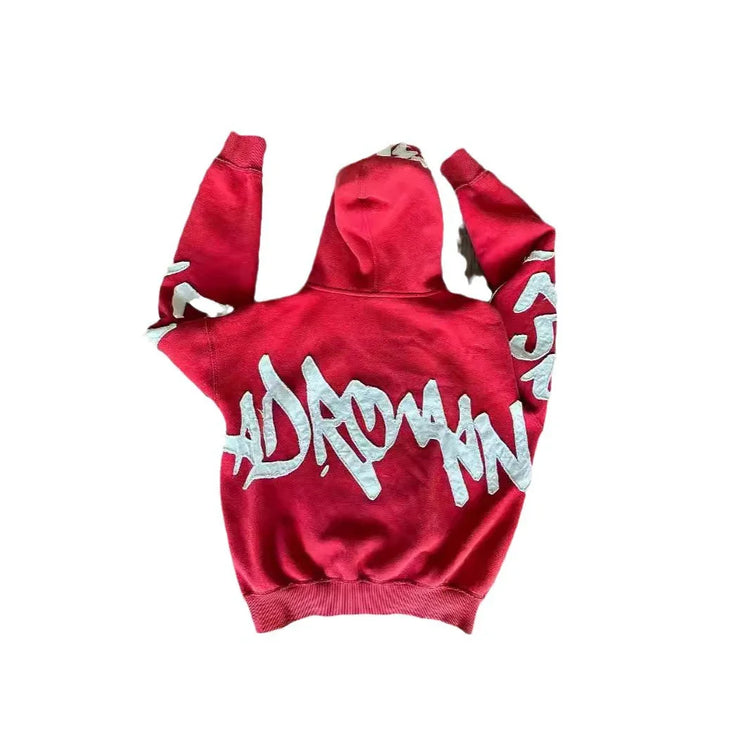 Red streetwear hoodie with white graffiti lettering, relaxed fit, cotton material