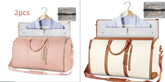 Two travel duffel bags, one pink and one beige with brown accents, shown with matching garment covers and mesh toiletry pouches, highlighting modern, functional design and spacious fit.