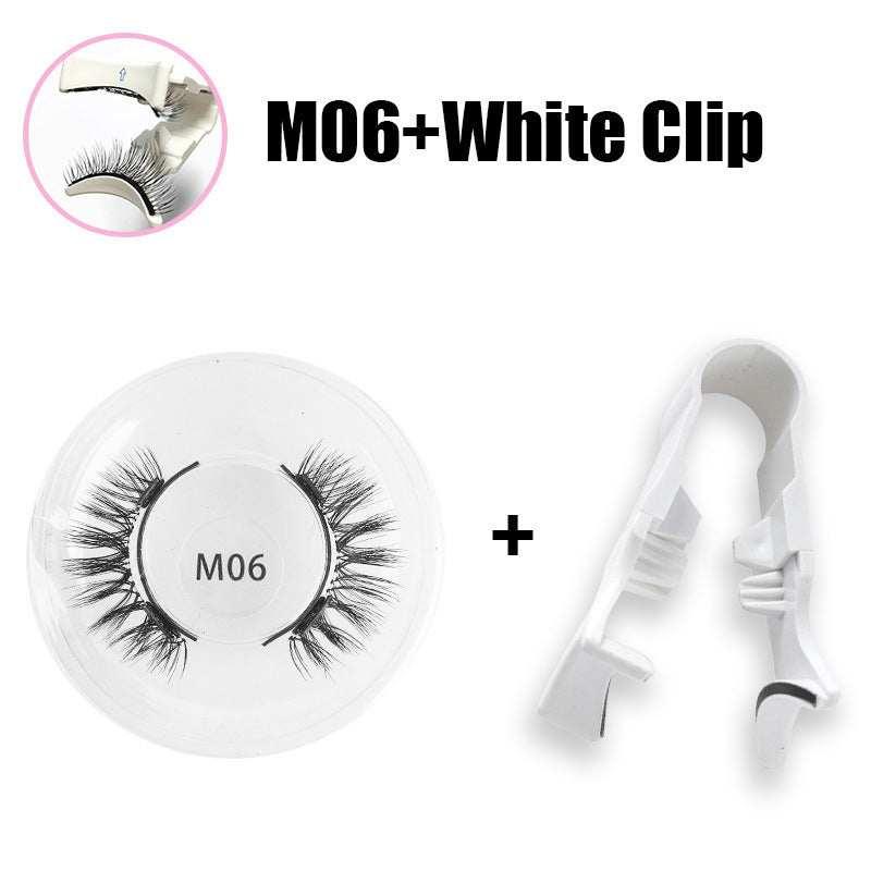 Pair of dramatic black false eyelashes in clear case with white plastic lash applicator clip
