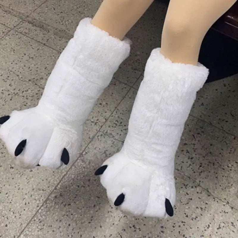 White plush animal paw slippers with black claw details, thick cozy material, oversized fit