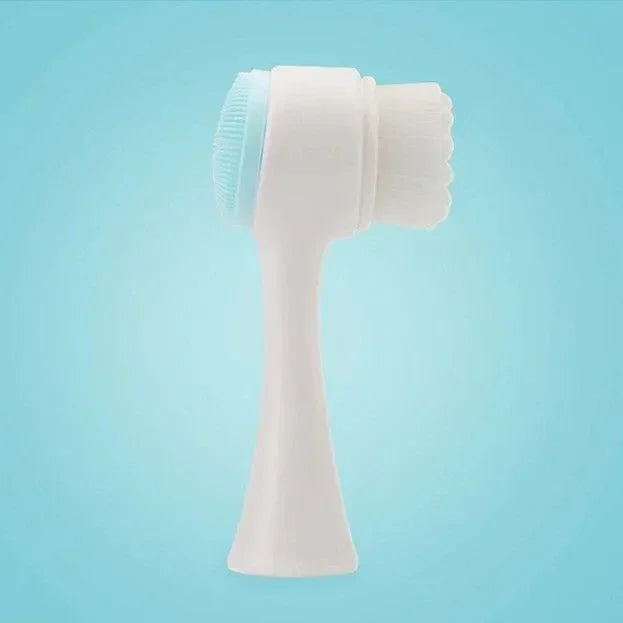 Dual-sided white facial cleansing brush with soft bristles and silicone scrubber