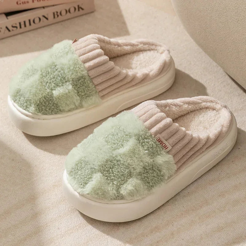 Cozy slip-on slippers with green plush upper, ribbed beige detailing, and thick white sole