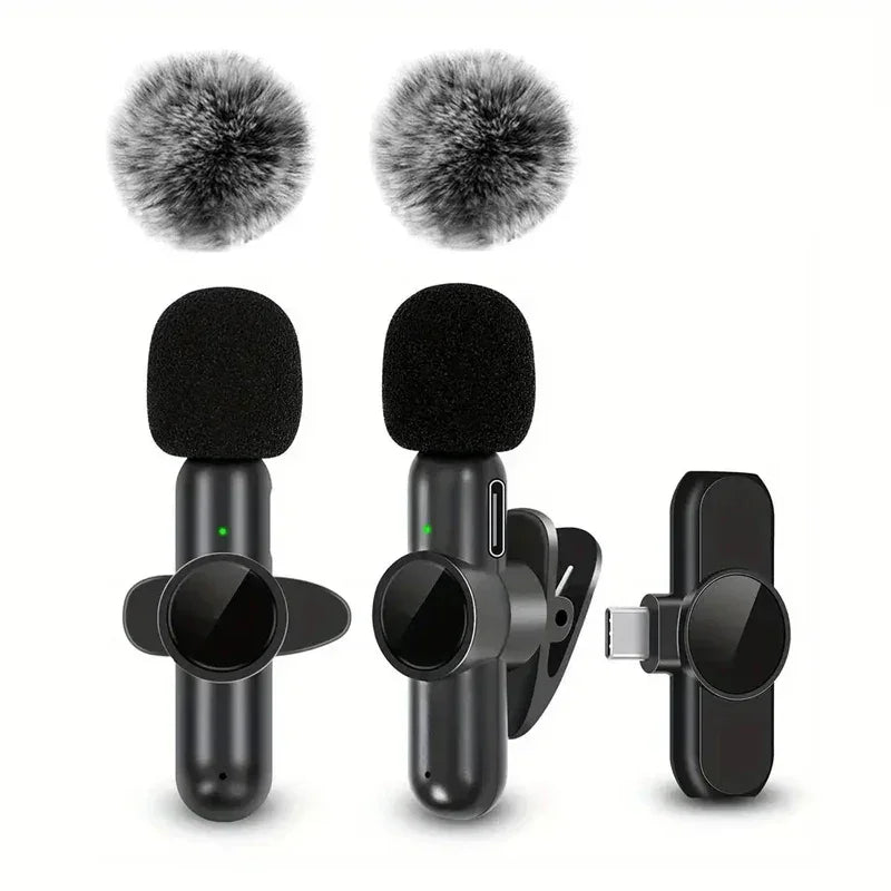 Wireless clip-on microphones with black foam covers and two gray windshields, USB-C receiver