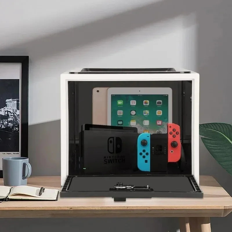 Modern UV sterilizer box holding a tablet and gaming console, desktop tech accessory
